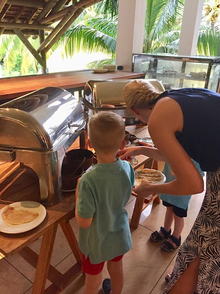 Children eat pancakes at Ravenala Attitude